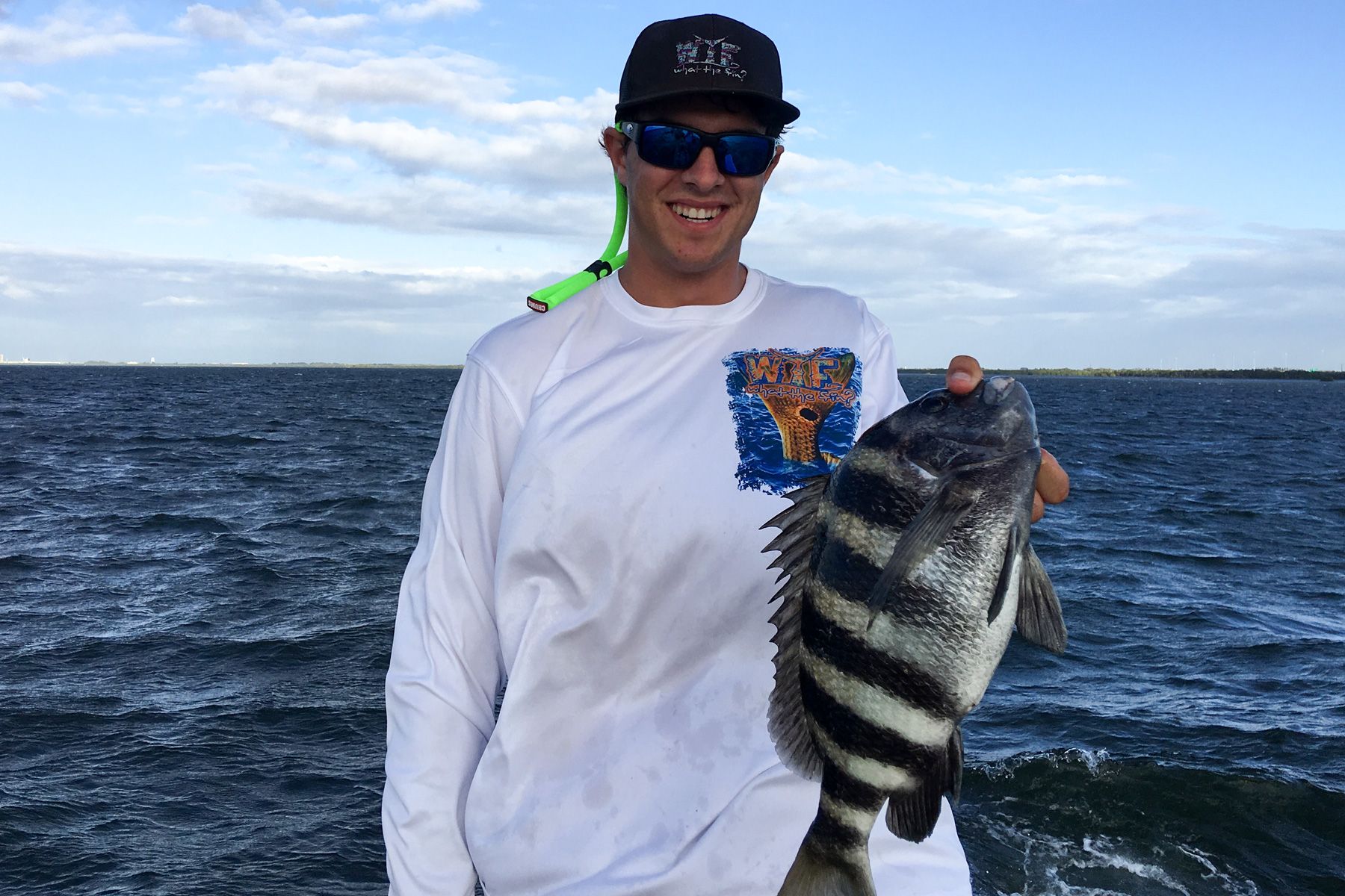 Holding a sheepshead that I caught in the ocean. 