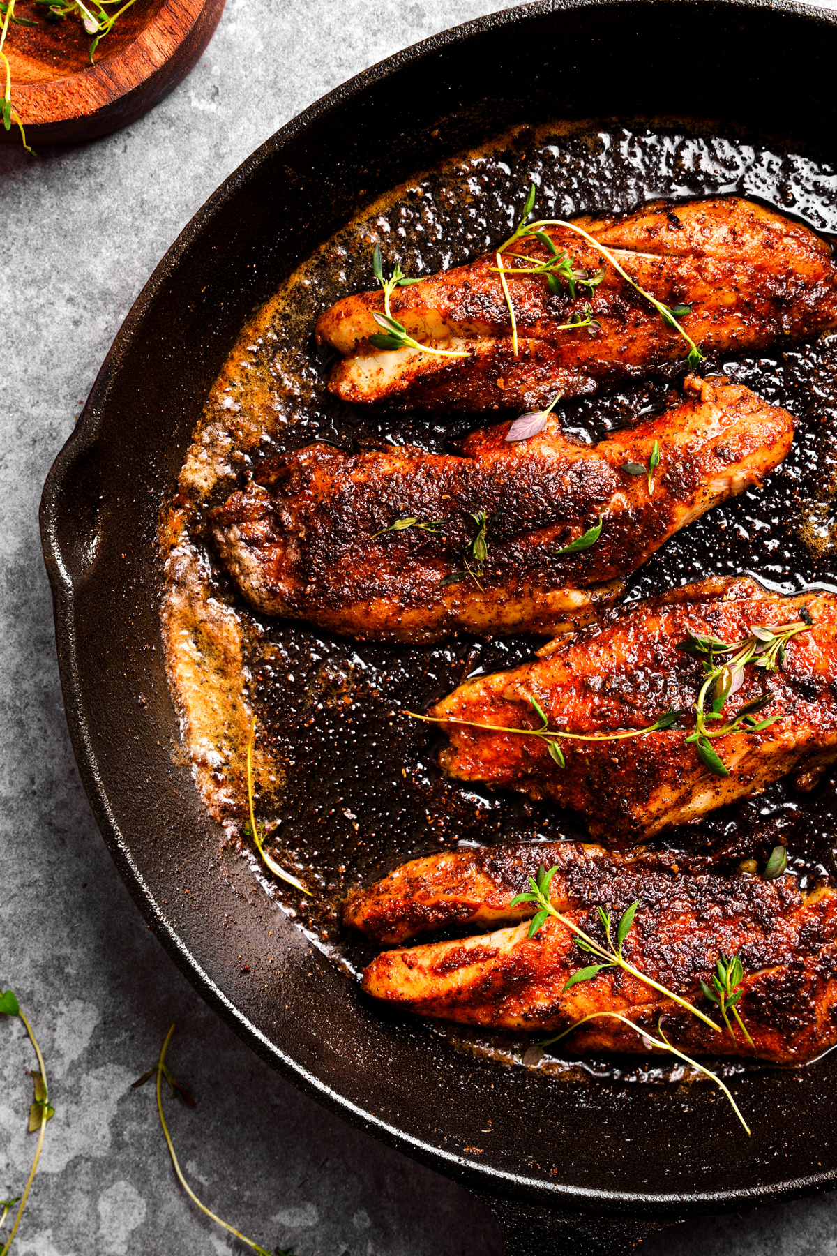 looking down at the sea trout recipe in a cast iron skillet 