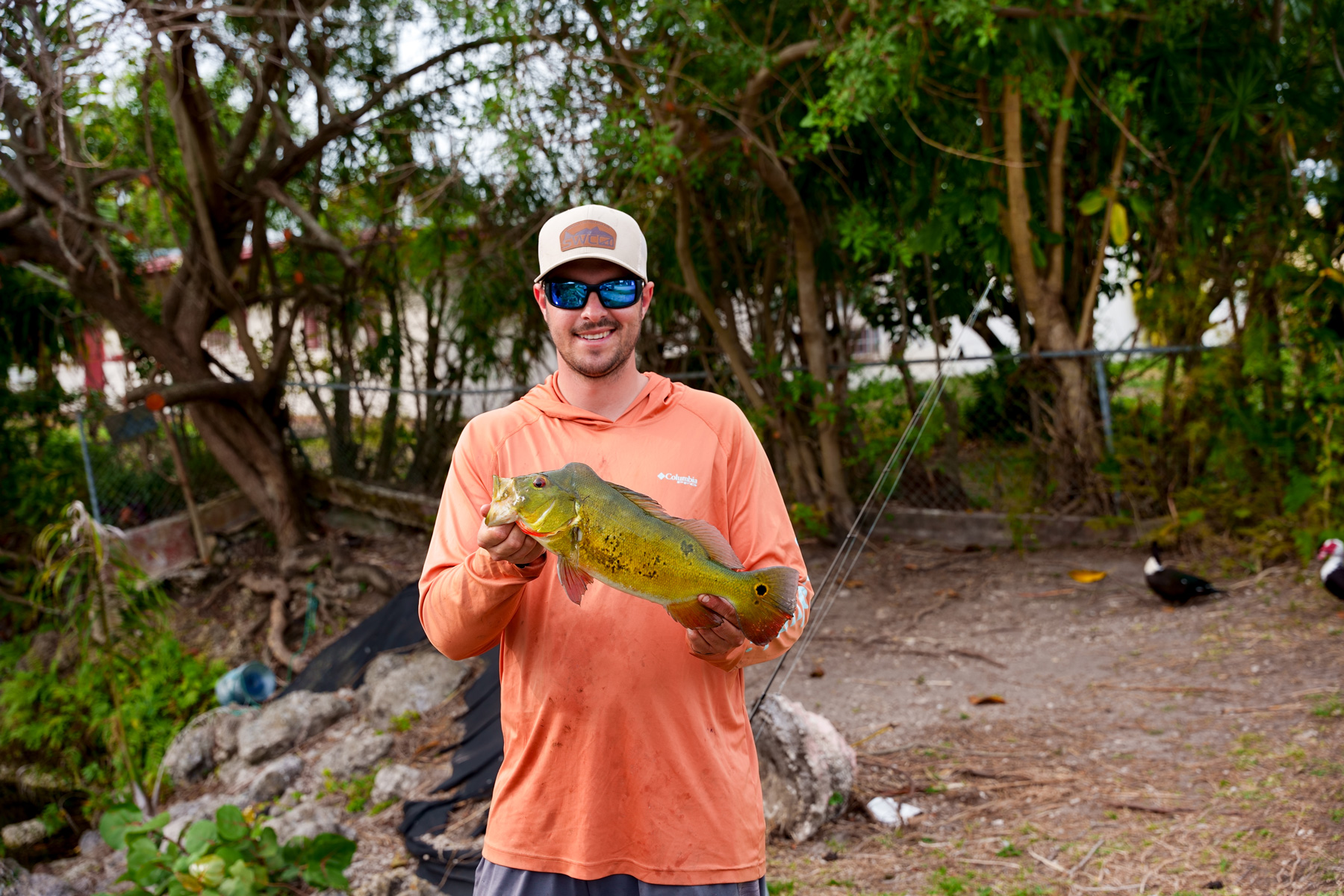 A picture of me with a peacock bass. 