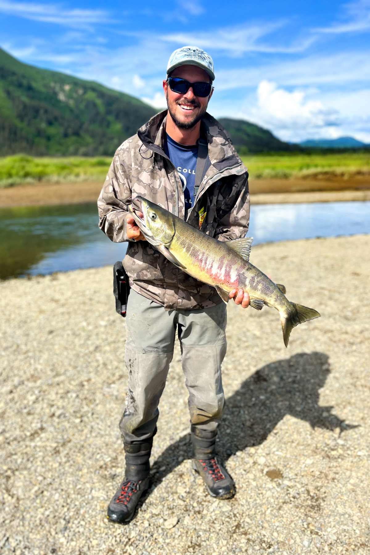 me with a chum salmon in a creek alaska 