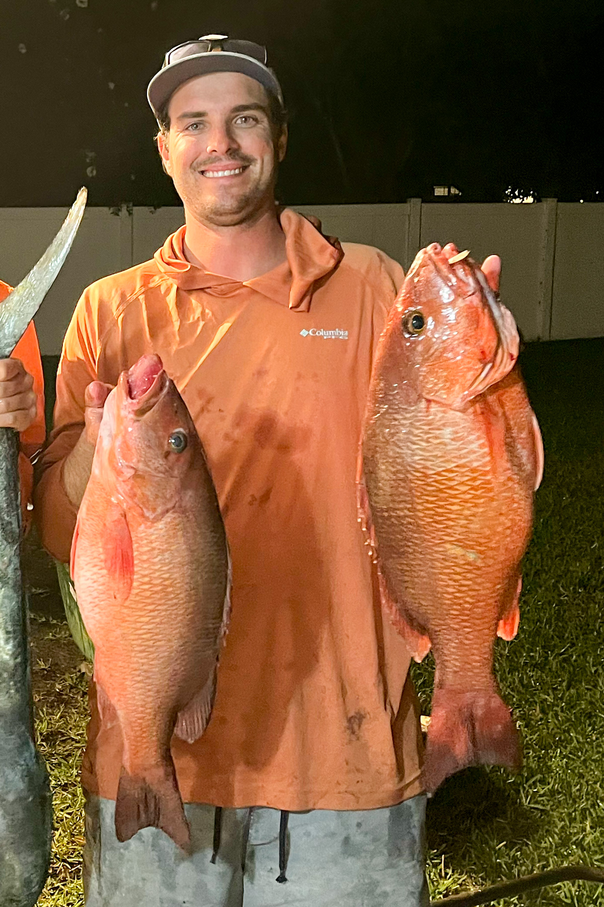 Myself, holding two Mangrove Snapper. 